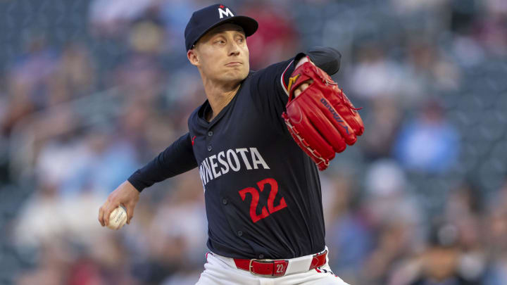 Jun 10, 2024; Minneapolis, Minnesota, USA; Minnesota Twins pitcher Griffin Jax (22) delivers a pitch against the Colorado Rockies in the eighth inning at Target Field. Mandatory Credit: Jesse Johnson-USA TODAY Sports