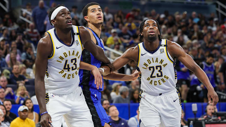 Mar 10, 2024; Orlando, Florida, USA; Indiana Pacers forward Pascal Siakam (43) forward Aaron Nesmith (23) and Orlando Magic guard Caleb Houstan (2) look for the rebound during the second quarter at KIA Center. Mandatory Credit: Mike Watters-Imagn Images