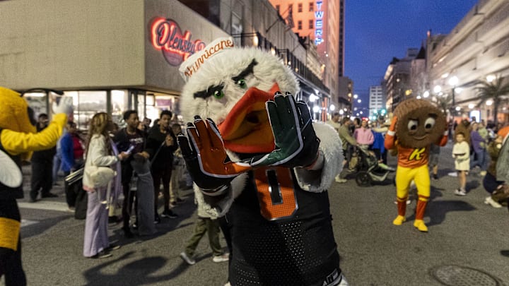 Jan 31, 2025; Mobile, AL, USA; Miami Hurricanes mascot Sebastian the Ibisas joins Senior Bowl football players in the Mardi Gras player parade in downtown Mobile. Mandatory Credit: Vasha Hunt-Imagn Images

