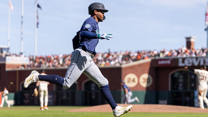 Seattle Mariners outfielder Julio Rodríguez scores during a game against the San Francisco Giants on April 4 at Oracle Park.