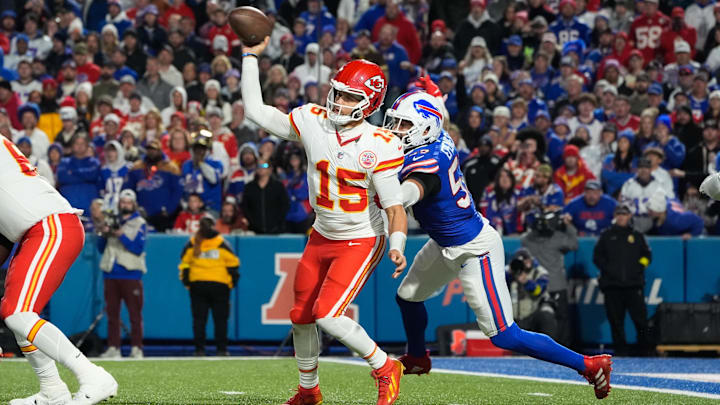 Nov 2, 2025; Orchard Park, New York, USA;  Kansas City Chiefs quarterback Patrick Mahomes (15) is pressured to throw by Buffalo Bills defensive end A.J. Epenesa (57) in the second half at Highmark Stadium. Mandatory Credit: Gregory Fisher-Imagn Images