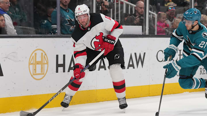 Jan 4, 2025; San Jose, California, USA; New Jersey Devils right wing Stefan Noesen (11) passes against San Jose Sharks center Alexander Wennberg (21) during the first period at SAP Center at San Jose. Mandatory Credit: Darren Yamashita-Imagn Images