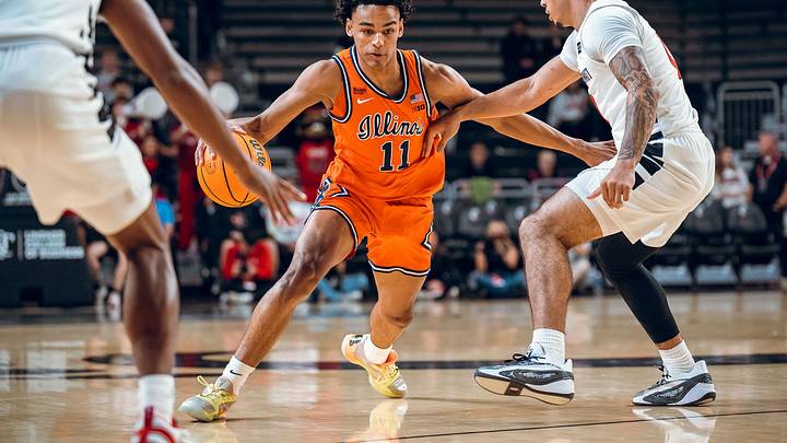 Illinois guard Quentin Coleman (11) drives against a Cincinnati defender in the Illini's 105-96 exhibition win over the Bearcats on Saturday in Cincinnati. Illinois guard Quentin Coleman (11) drives against a Cincinnati defender in the Illini's 105-96 exhibition win over the Bearcats on Saturday in Cincinnati.
