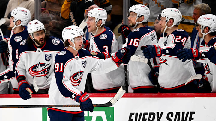 Blue Jackets forward Kent Johnson celebrates a shootout goal with his teammates.