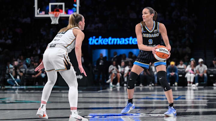 Aug 21, 2025; Brooklyn, New York, USA; Chicago Sky guard Rebecca Allen (9) sets the play while defended by New York Liberty guard Sabrina Ionescu (20) during the first half at Barclays Center. Mandatory Credit: John Jones-Imagn Images