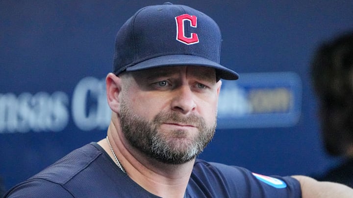 Sep 4, 2024; Kansas City, Missouri, USA; Cleveland Guardians manager Stephen Vogt (12) watches from the dugout against the Kansas City Royals prior to a game at Kauffman Stadium. Mandatory Credit: Denny Medley-Imagn Images