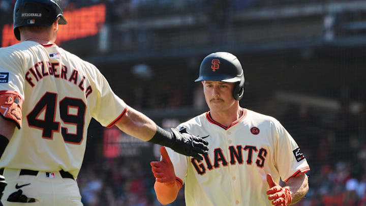 Sep 28, 2024; San Francisco, California, USA; San Francisco Giants infielder Matt Chapman (26) shakes hands with infielder Tyler Fitzgerald (49) after scoring a run against the St. Louis Cardinals during the fourth inning at Oracle Park. 