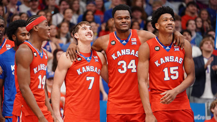 Kansas Jayhawks players hug each other following the Sunflower Showdown game inside Allen Fieldhouse in Lawrence, Kansas, on Saturday, March 7, 2026.