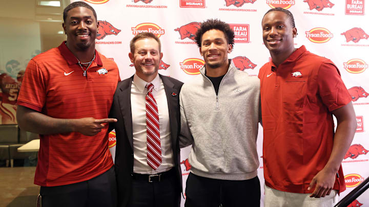 Dec 4, 2025; Fayetteville, AR, USA; Arkansas Razorbacks defensive end Quincy Rhodes Jr, head coach Ryan Silverfield, wide receiver CJ Brown, and quarterback KJ Jackson during the introductory press conference for Silverfield at Frank Broyles Center. Mandatory Credit: Nelson Chenault-Imagn Images Dec 4, 2025; Fayetteville, AR, USA; Arkansas Razorbacks defensive end Quincy Rhodes Jr, head coach Ryan Silverfield, wide receiver CJ Brown, and quarterback KJ Jackson during the introductory press conference for Silverfield at Frank Broyles Center. Mandatory Credit: Nelson Chenault-Imagn Images