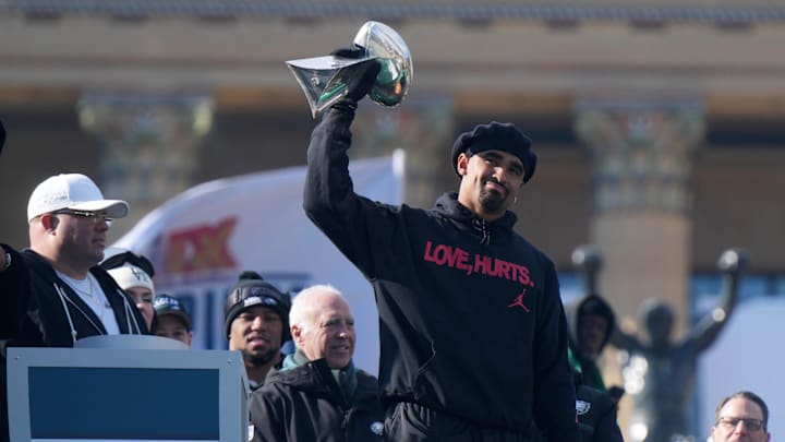Feb 14, 2025; Philadelphia, PA, USA; Philadelphia Eagles quarterback Jalen Hurts holds the Vince Lombardi Trophy during the Super Bowl LIX championship parade and rally. Mandatory Credit: Kirby Lee-Imagn Images Feb 14, 2025; Philadelphia, PA, USA; Philadelphia Eagles quarterback Jalen Hurts holds the Vince Lombardi Trophy during the Super Bowl LIX championship parade and rally. Mandatory Credit: Kirby Lee-Imagn Images