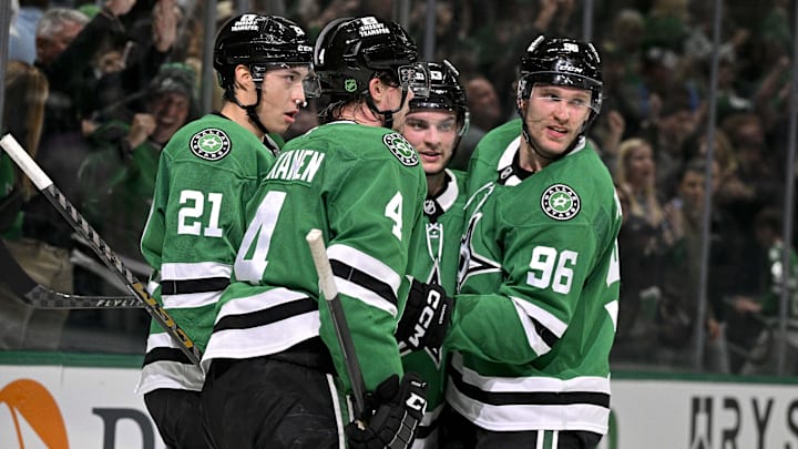 Apr 7, 2026; Dallas, Texas, USA; Dallas Stars defenseman Miro Heiskanen (4) and left wing Jason Robertson (21) and center Wyatt Johnston (53) and right wing Mikko Rantanen (96) celebrate after Johnston scores the game winning power-play goal against Calgary Flames goaltender Devin Cooley (not pictured) during the overtime period at the American Airlines Center. Mandatory Credit: Jerome Miron-Imagn Images Apr 7, 2026; Dallas, Texas, USA; Dallas Stars defenseman Miro Heiskanen (4) and left wing Jason Robertson (21) and center Wyatt Johnston (53) and right wing Mikko Rantanen (96) celebrate after Johnston scores the game winning power-play goal against Calgary Flames goaltender Devin Cooley (not pictured) during the overtime period at the American Airlines Center. Mandatory Credit: Jerome Miron-Imagn Images