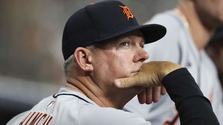 Detroit Tigers manager A.J. Hinch (14) looks on from the dugout during the second inning against the Houston Astros at Daikin Park.