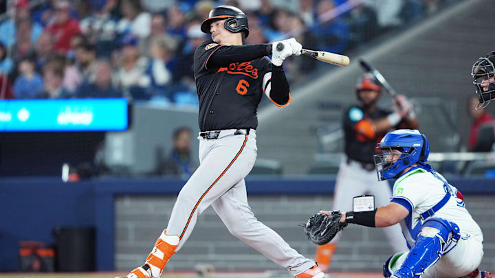 Mar 27, 2025; Toronto, Ontario, CAN; Baltimore Orioles first base Ryan Mountcastle (6) hits a double against the Toronto Blue Jays during the second inning at Rogers Centre. Mar 27, 2025; Toronto, Ontario, CAN; Baltimore Orioles first base Ryan Mountcastle (6) hits a double against the Toronto Blue Jays during the second inning at Rogers Centre.