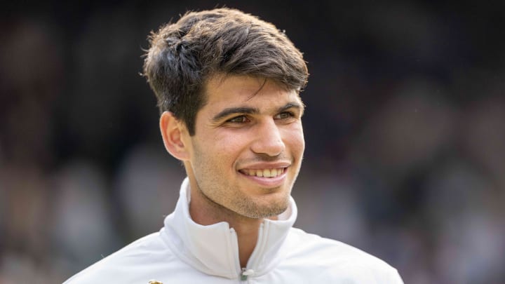 Jul 14, 2024; London, United Kingdom; Carlos Alcaraz of Spain poses with the trophy after winning the men’s singles match against Novak Djokovic of Serbia on day 14 at All England Lawn Tennis and Croquet Club. Mandatory Credit: Susan Mullane-USA TODAY Sports Jul 14, 2024; London, United Kingdom; Carlos Alcaraz of Spain poses with the trophy after winning the men’s singles match against Novak Djokovic of Serbia on day 14 at All England Lawn Tennis and Croquet Club. Mandatory Credit: Susan Mullane-USA TODAY Sports