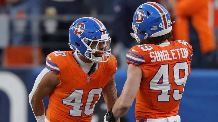Jan 4, 2026; Denver, Colorado, USA; Denver Broncos linebacker Justin Strnad (40) celebrates with linebacker Alex Singleton (49) after a sack during the second half against the Los Angeles Chargers at Empower Field at Mile High. Jan 4, 2026; Denver, Colorado, USA; Denver Broncos linebacker Justin Strnad (40) celebrates with linebacker Alex Singleton (49) after a sack during the second half against the Los Angeles Chargers at Empower Field at Mile High.