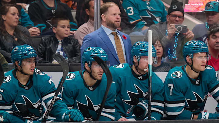 Nov 2, 2024; San Jose, California, USA; San Jose Sharks head coach Ryan Warsofsky watches the game against the Vancouver Canucks during the first period at SAP Center at San Jose. Mandatory Credit: Robert Edwards-Imagn Images