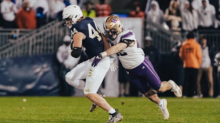 UW linebacker Carson Bruener tries to bring down Penn State tight end Tyler Warren.