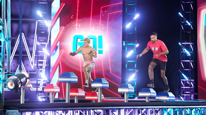 AMERICAN NINJA WARRIOR -- "Finals 4" Episode 1713 -- Pictured: (l-r) Kai Beckstrand, Isaiah Thomas -- (Photo by: Greg Gayne/NBC)
