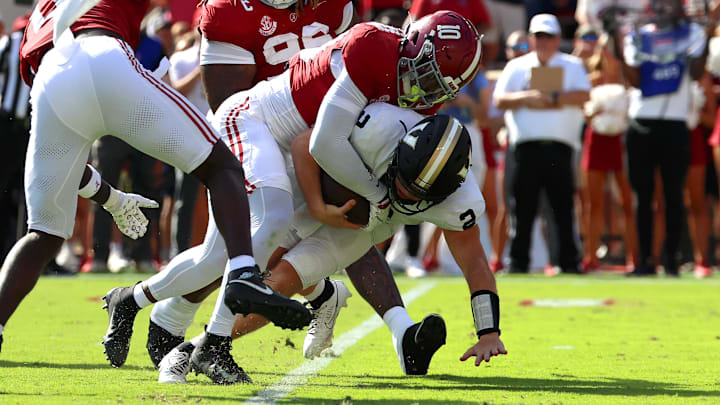 Oct 4, 2025; Tuscaloosa, Alabama, USA; Vanderbilt Commodores quarterback Diego Pavia (2) is taken down by Alabama Crimson Tide linebacker Justin Jefferson (10) during the first quarter at Saban Field at Bryant-Denny Stadium. Mandatory Credit: David Leong-Imagn Images