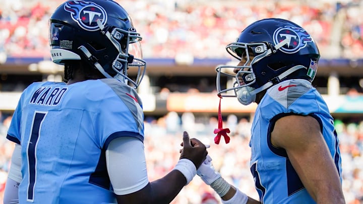 Tennessee Titans quarterback Cam Ward (1) and wide receiver Chimere Dike (17) celebrate their touchdown play during the third quarter against the Kansas City Chiefs at Nissan Stadium in Nashville, Tenn., Sunday, Dec. 21, 2025.