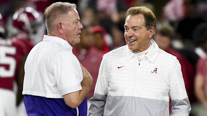 Nov 4, 2023; Tuscaloosa, Alabama, USA;  LSU Tigers head coach Brian Kelly and Alabama Crimson Tide head coach Nick Saban talk together at midfield before the Alabama vs LSU game at Bryant-Denny Stadium. Mandatory Credit: Gary Cosby Jr.-Imagn Images