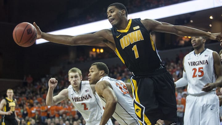 Mar 27, 2013; Charlottesville, VA, USA; Iowa Hawkeyes forward Melsahn Basabe (1) reaches for a rebound against the Virginia Cavaliers during the first half at John Paul Jones Arena. Mandatory Credit: Peter Casey-Imagn Images