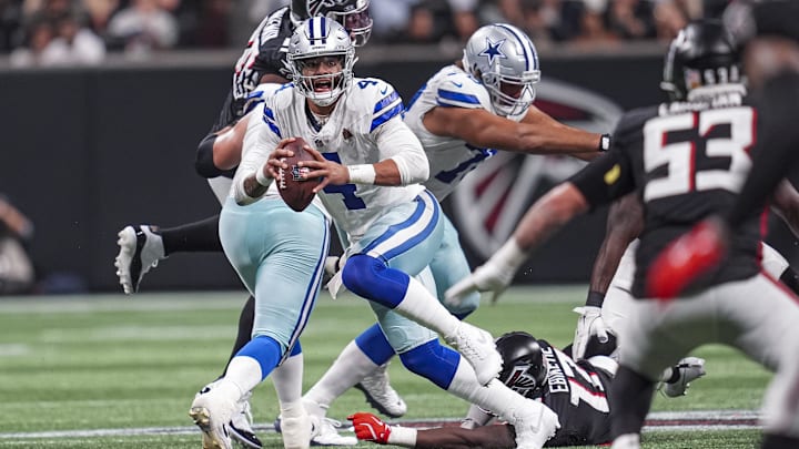 Nov 3, 2024; Atlanta, Georgia, USA; Dallas Cowboys quarterback Dak Prescott (4) runs out of the pocket against the Atlanta Falcons during the second half at Mercedes-Benz Stadium. Mandatory Credit: Dale Zanine-Imagn Images