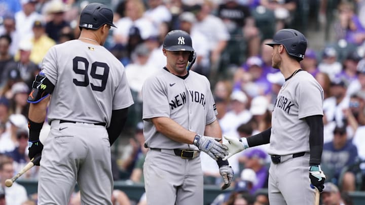 May 24, 2025; Denver, Colorado, USA; New York Yankees first base Paul Goldschmidt (48) celebrates scoring a run with right fielder Aaron Judge (99) and left fielder Cody Bellinger (35) in the fifth inning against the Colorado Rockies at Coors Field. Mandatory Credit: Ron Chenoy-Imagn Images