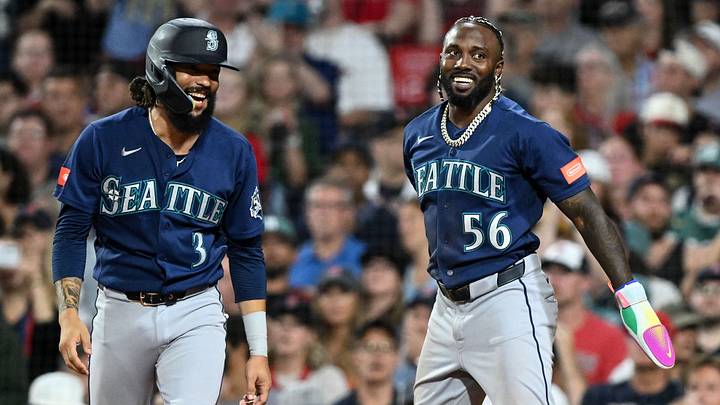 Aug 31, 2026; Boston, Massachusetts, USA; Seattle Mariners shortstop J.P. Crawford (3) and left fielder Randy Arozarena (56) react after scoring a run against the Boston Red Sox during the sixth inning at Fenway Park. Mandatory Credit: Brian Fluharty-Imagn Images