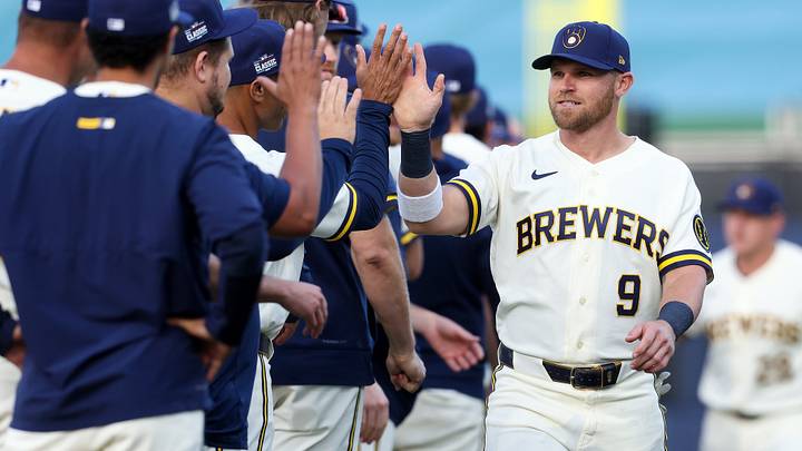 Aug 23, 2026; Williamsport, PA, USA; Milwaukee Brewers infielder Jake Bauers (9) shakes hands with his teammates prior to the MLB Little League Classic game against the Atlanta Braves at Journey Bank Ballpark at Historic Bowman Field. Mandatory Credit: Matthew O'Haren-Imagn Images Aug 23, 2026; Williamsport, PA, USA; Milwaukee Brewers infielder Jake Bauers (9) shakes hands with his teammates prior to the MLB Little League Classic game against the Atlanta Braves at Journey Bank Ballpark at Historic Bowman Field. Mandatory Credit: Matthew O'Haren-Imagn Images