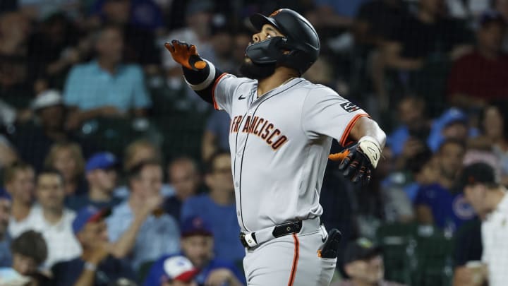 Jun 17, 2024; Chicago, Illinois, USA; San Francisco Giants outfielder Heliot Ramos (17) celebrates as he crosses home plate after hitting a solo home run against the Chicago Cubs during the seventh inning at Wrigley Field
