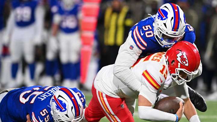 Nov 2, 2025; Orchard Park, New York, USA; Kansas City Chiefs quarterback Patrick Mahomes (15) is brought down by Buffalo Bills defensive end Michael Hoecht (55) and  defensive end Greg Rousseau (50) in the third quarter at Highmark Stadium. Mandatory Credit: Mark Konezny-Imagn Images
