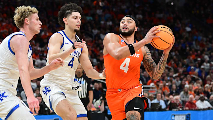 Mar 23, 2025; Milwaukee, WI, USA;  Illinois Fighting Illini guard Kylan Boswell (4) drives to the basket against Kentucky Wildcats guard Koby Brea (4) during the first half in the second round of the NCAA Tournament at Fiserv Forum. Mandatory Credit: Benny Sieu-Imagn Images