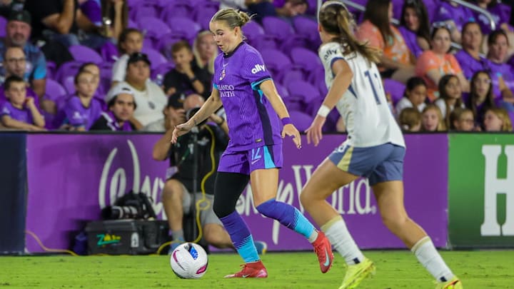 Nov 2, 2025; Orlando, Florida, USA; Orlando Pride midfielder Cori Dyke (12) handles the ball during the second half against Seattle Reign at Inter&Co Stadium. Mandatory Credit: Mike Watters-Imagn Images