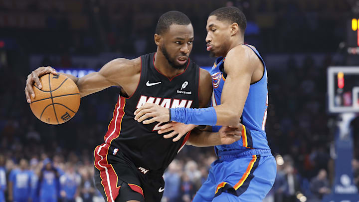 Feb 12, 2025; Oklahoma City, Oklahoma, USA; Miami Heat forward Andrew Wiggins (22) drives to the basket against Oklahoma City Thunder guard Aaron Wiggins (21) during the first quarter at Paycom Center. Mandatory Credit: Alonzo Adams-Imagn Images