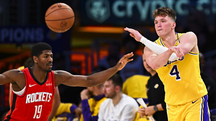 Apr 11, 2025; Los Angeles, California, USA: Los Angeles Lakers guard Dalton Knecht (4) passes against Houston Rockets guard Nate Williams (19) during the second half at Crypto.com Arena. Mandatory Credit: Jonathan Hui-Imagn Images Apr 11, 2025; Los Angeles, California, USA: Los Angeles Lakers guard Dalton Knecht (4) passes against Houston Rockets guard Nate Williams (19) during the second half at Crypto.com Arena. Mandatory Credit: Jonathan Hui-Imagn Images