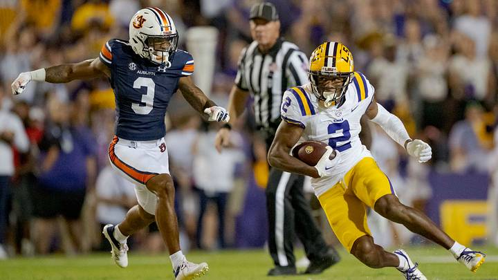 Oct 14, 2023; Baton Rouge, Louisiana, USA; LSU Tigers wide receiver Kyren Lacy (2) runs after a reception against Auburn Tigers cornerback Kayin Lee (3) at Tiger Stadium. Mandatory Credit: Matthew Hinton-USA TODAY Sports