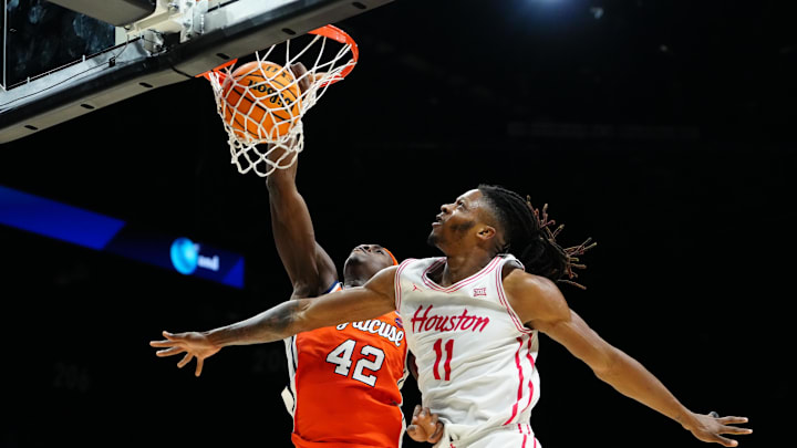 Nov 24, 2025; Las Vegas, Nevada, USA; Syracuse Orange forward William Kyle III (42) drives to the hoop past Houston Cougars forward Joseph Tugler (11) during the second half of a 2025 Players Era Festival group play game at MGM Grand Garden Arena. Mandatory Credit: Stephen R. Sylvanie-Imagn Images