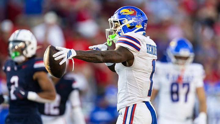 Kansas Jayhawks wide receiver Emmanuel Henderson Jr. (1) celebrates a first down against the Arizona Wildcats. Kansas Jayhawks wide receiver Emmanuel Henderson Jr. (1) celebrates a first down against the Arizona Wildcats.