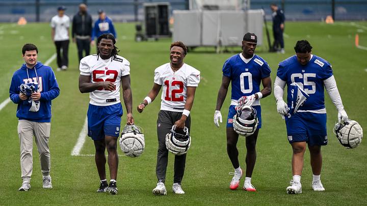 May 9, 2026; East Rutherford, NJ, USA; New York Giants rookies Arvell Reese (52), Colton Hood (12), Malachi Fields (0) and Francis Mauigoa (65) walk off the field after rookie minicamp at Quest Diagnostics Training Center. Mandatory Credit: John Jones-Imagn Images