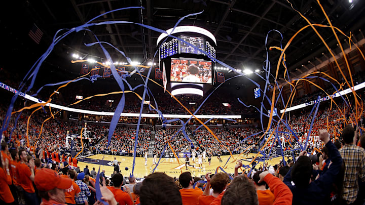 Mar 5, 2016; Charlottesville, VA, USA; Virginia Cavaliers fans throw streamers after the Cavaliers' first basket against the Louisville Cardinals in the first half at John Paul Jones Arena. Mandatory Credit: Geoff Burke-Imagn Images