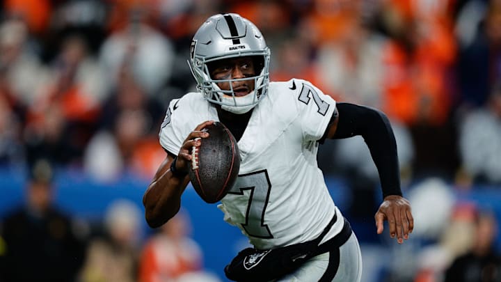Nov 6, 2025; Denver, Colorado, USA; Las Vegas Raiders quarterback Geno Smith (7) scrambles with the ball in the fourth quarter against the Denver Broncos at Empower Field at Mile High. Mandatory Credit: Isaiah J. Downing-Imagn Images