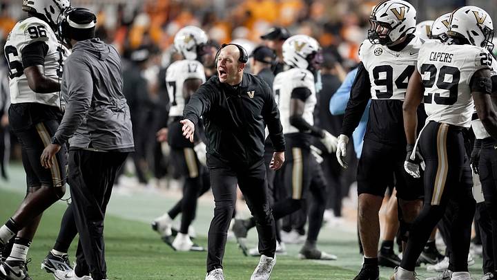 Vanderbilt coach Clark Lea congratulates defensive players after they made a third down stop against Tennessee during the third quarter at Neyland Stadium in Knoxville, Tenn., Saturday, Nov. 29, 2025. Vanderbilt coach Clark Lea congratulates defensive players after they made a third down stop against Tennessee during the third quarter at Neyland Stadium in Knoxville, Tenn., Saturday, Nov. 29, 2025.