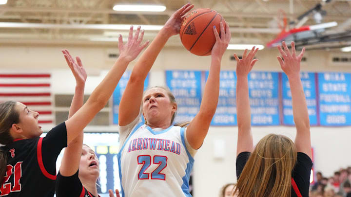 Arrowhead's Natalie Kussow (22) grabs a rebound during a fierce non-conference game versus Wauwatosa East on Jan. 27, 2026. 
