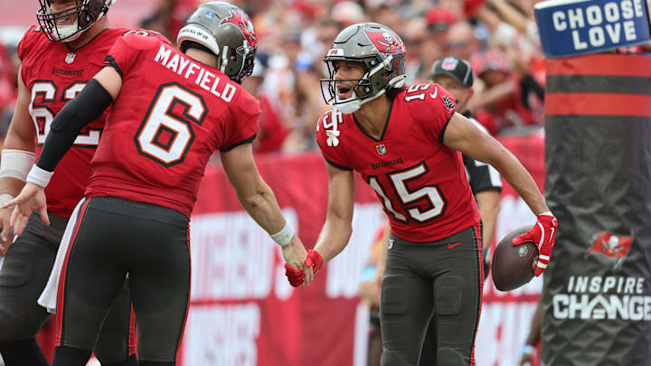 Ex-Husky wide receiver Jalen McMillan receives congratulations from Baker Mayfield during his two-touchdown game. Ex-Husky wide receiver Jalen McMillan receives congratulations from Baker Mayfield during his two-touchdown game.