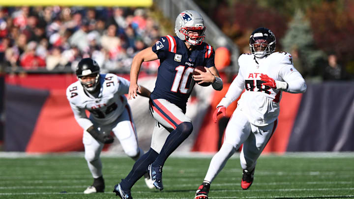 Nov 2, 2025; Foxborough, Massachusetts, USA; New England Patriots quarterback Drake Maye (10) scrambles with the ball against the Atlanta Falcons during the first quarter at Gillette Stadium. Mandatory Credit: Brian Fluharty-Imagn Images