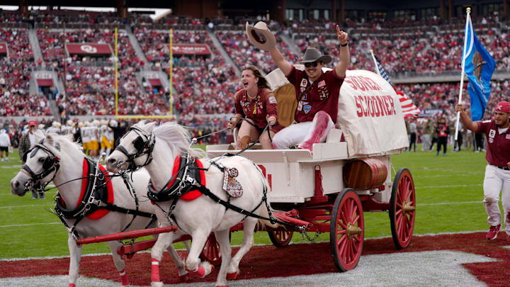The Sooner Schooner exits the field as Oklahoma battles Missouri.