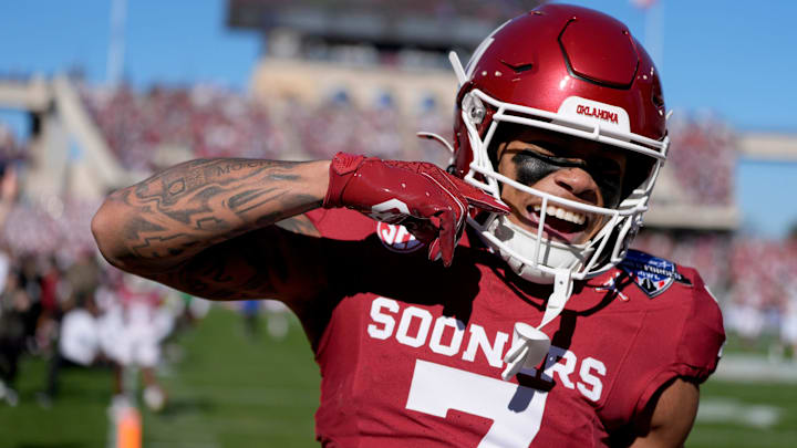 Oklahoma wide receiver Zion Kearney celebrates after scoring a touchdown in the Armed Forces Bowl against Navy in 2024.