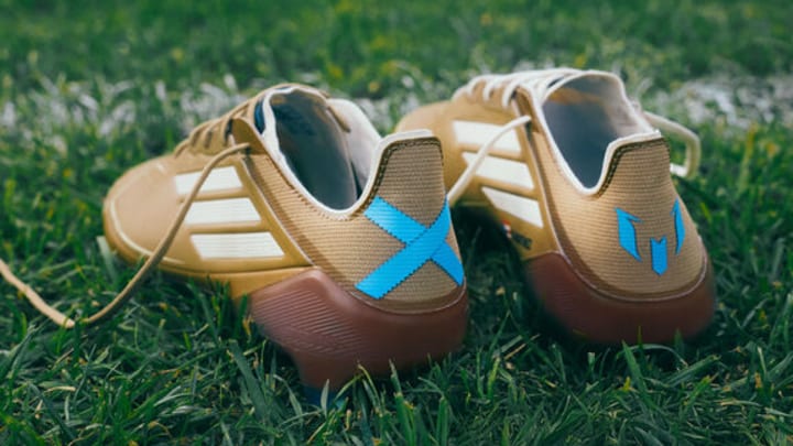Botines messi dorados sales