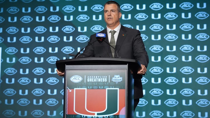 Jul 24, 2024; Charlotte, NC, USA; Miami Hurricanes head coach Mario Cristobal speaks to the media during the ACC Kickoff at Hilton Charlotte Uptown. Mandatory Credit: Jim Dedmon-USA TODAY Sports Jul 24, 2024; Charlotte, NC, USA; Miami Hurricanes head coach Mario Cristobal speaks to the media during the ACC Kickoff at Hilton Charlotte Uptown. Mandatory Credit: Jim Dedmon-USA TODAY Sports